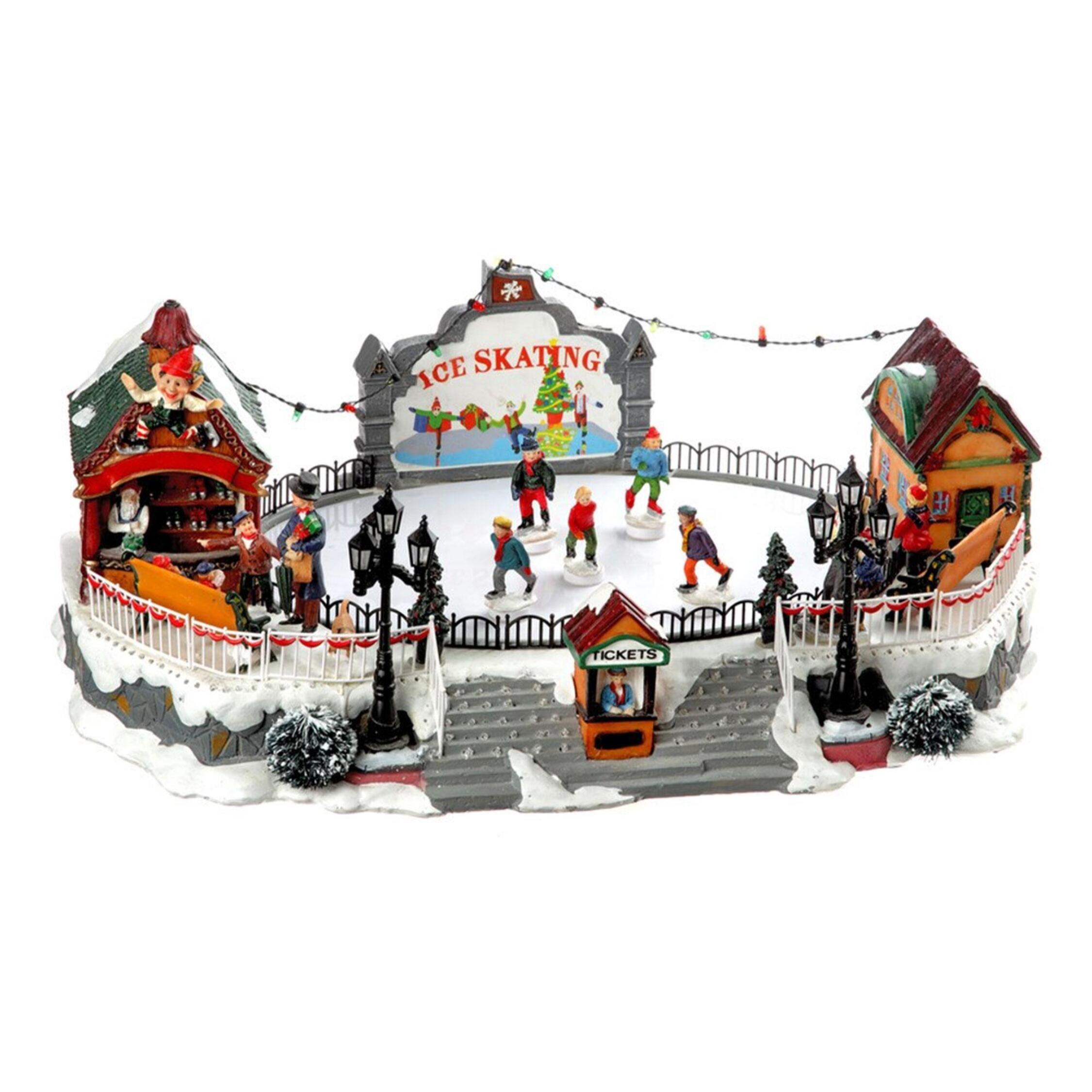 Pista de patinaje de decoración navideña con luces led y movimiento 21x22,5x39cm