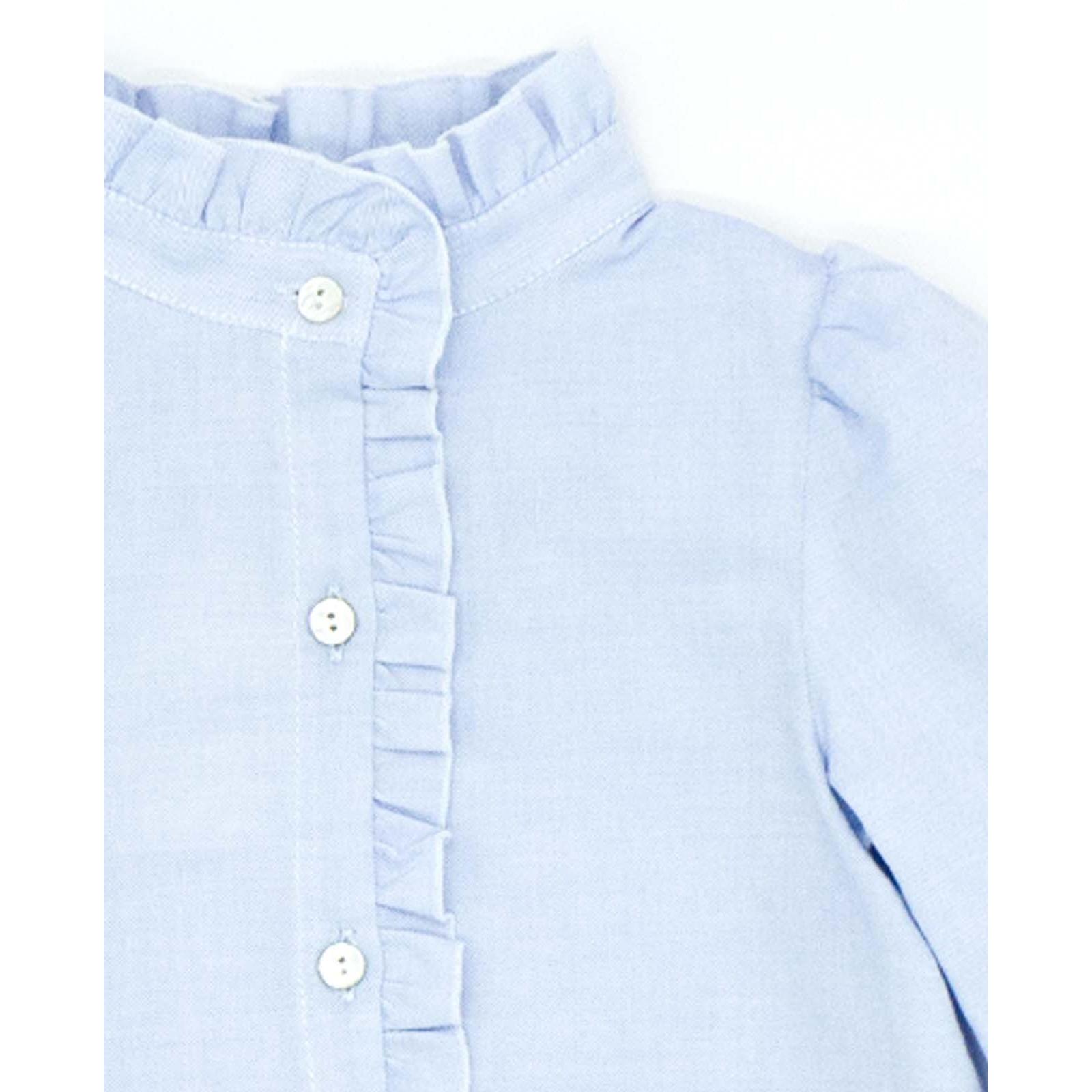 Camisa azul con volantes