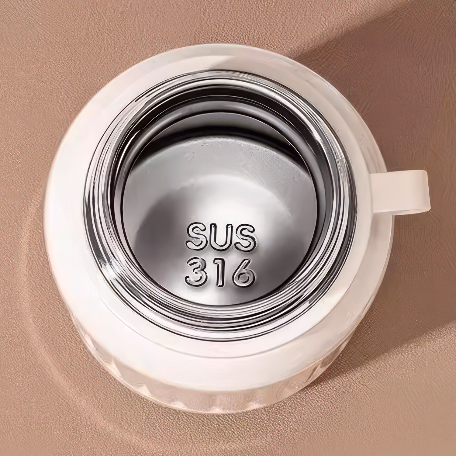 Termo MD-K933 de 300 ml con sellado antifugas, colador para infusiones y tapa convertible en vaso. Incluye apertura de 180°, cordón desmontable y excelente conservación térmica.