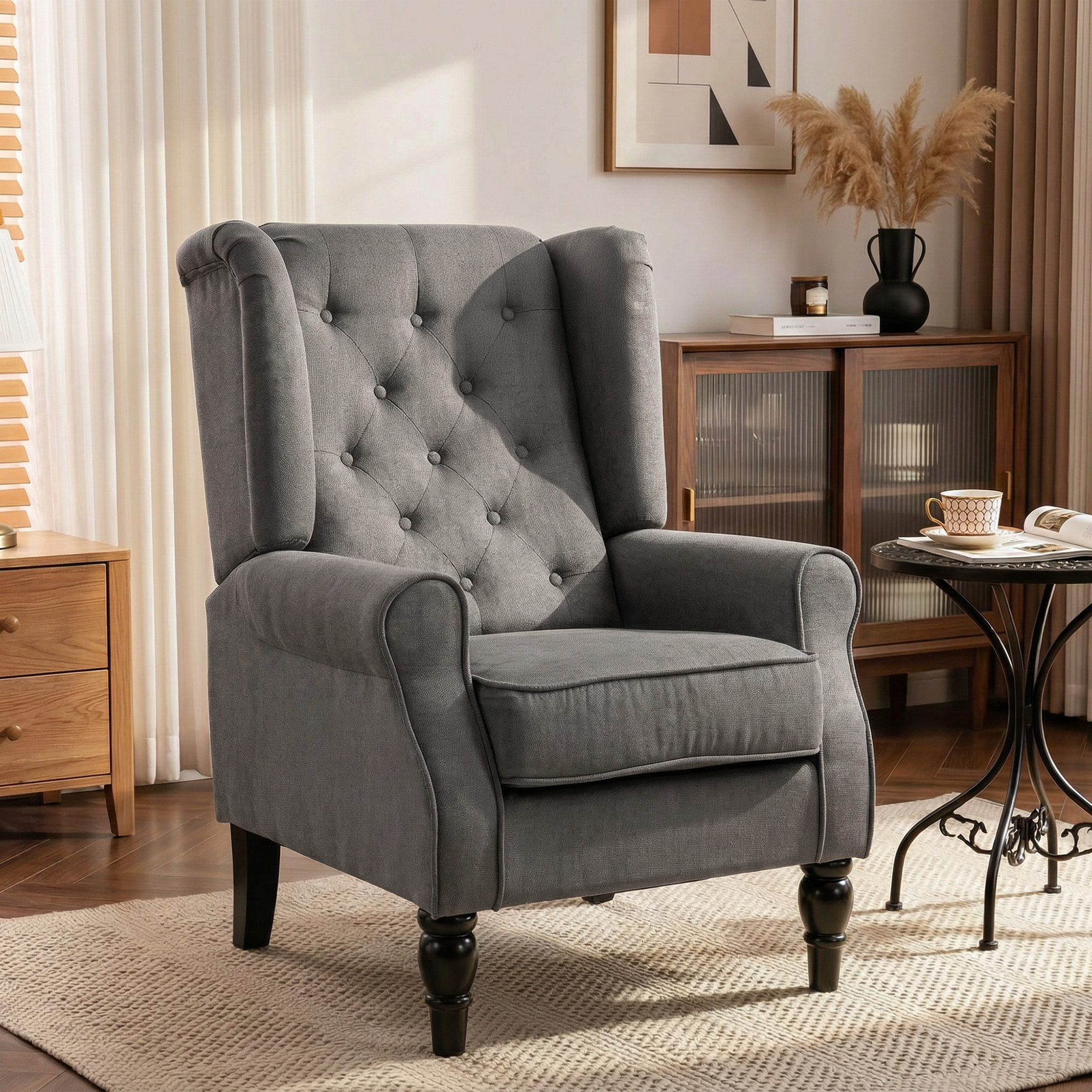 Fauteuil à oreilles style Chesterfield dossier capitonné grand confort bois noir tissu gris foncé