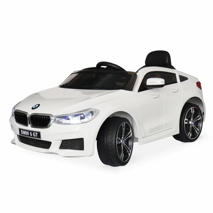 BMW Série 6 GT blanche. voiture électrique pour enfants 12V 4 Ah. 1 place. avec autoradio et télécommande