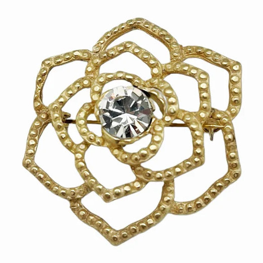 Broche cristal Sw. en color cristal zamak dorado. 4.5cm