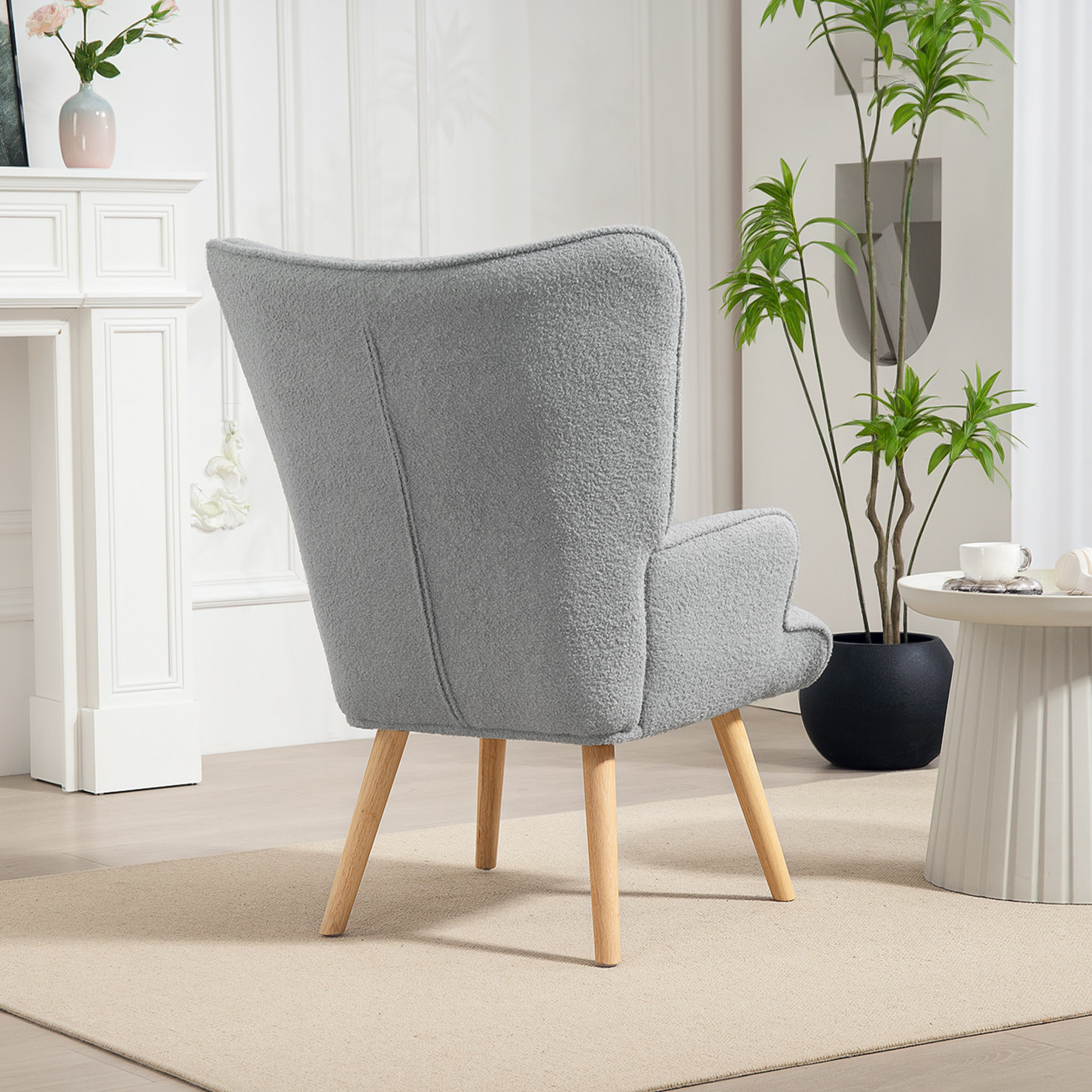 Fauteuil à oreilles style nordique piètement bois effet laine bouclée gris