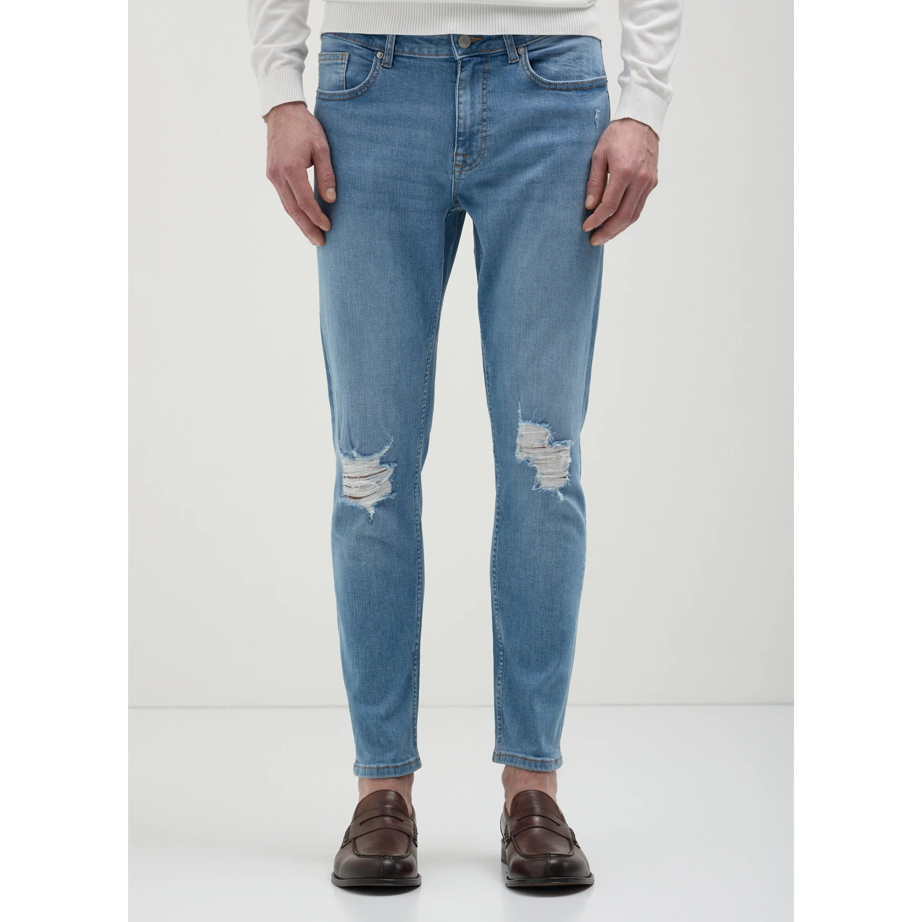 Jeans skinny con rotture