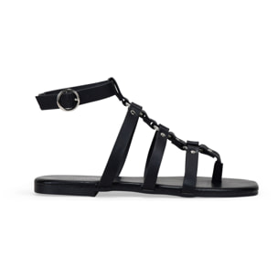 Sandalias planas negras con tira de dedo