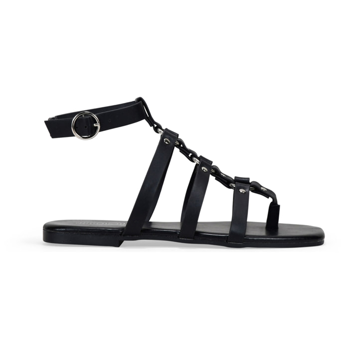 Sandalias planas negras con tira de dedo