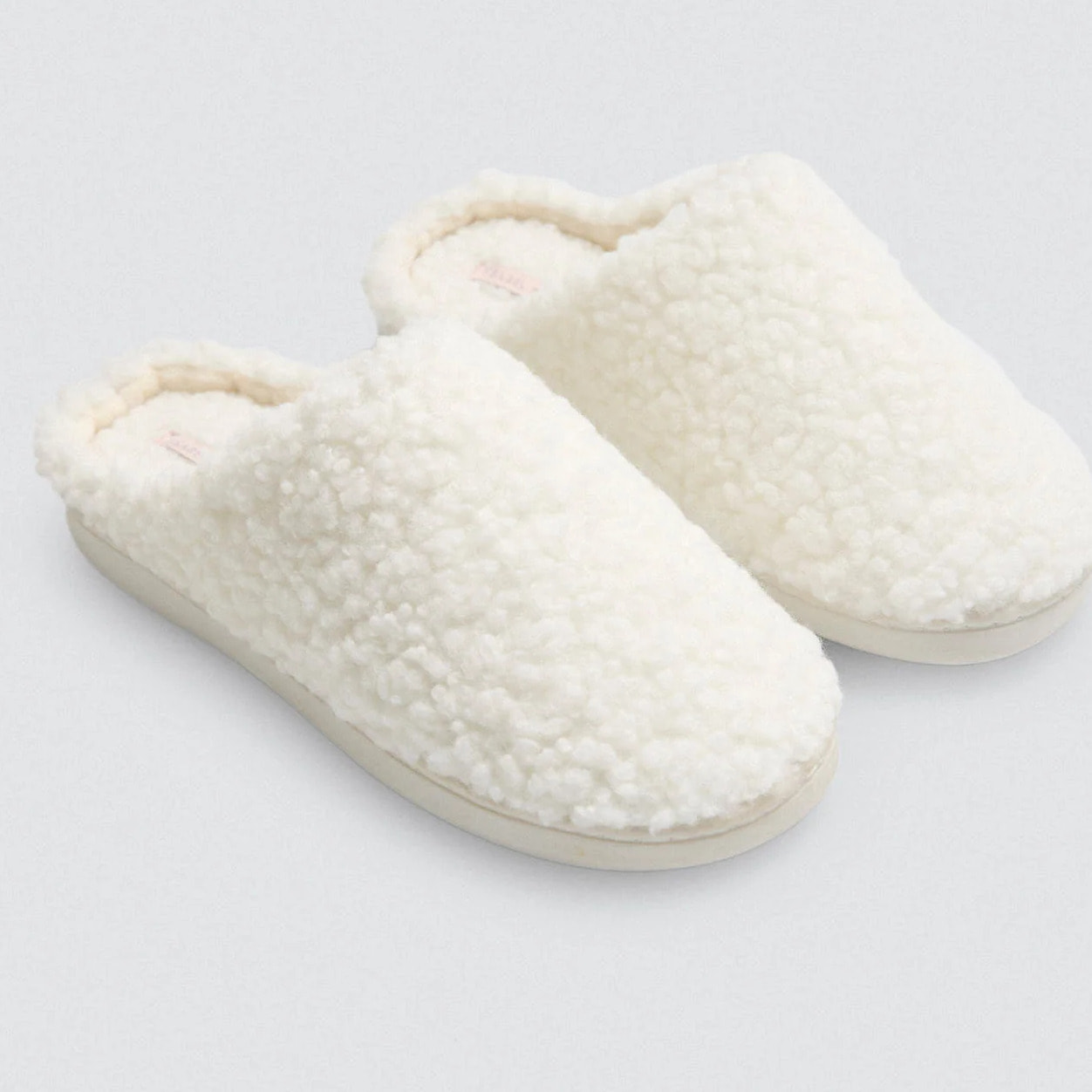 Pantofole di pelle di pecora bianca