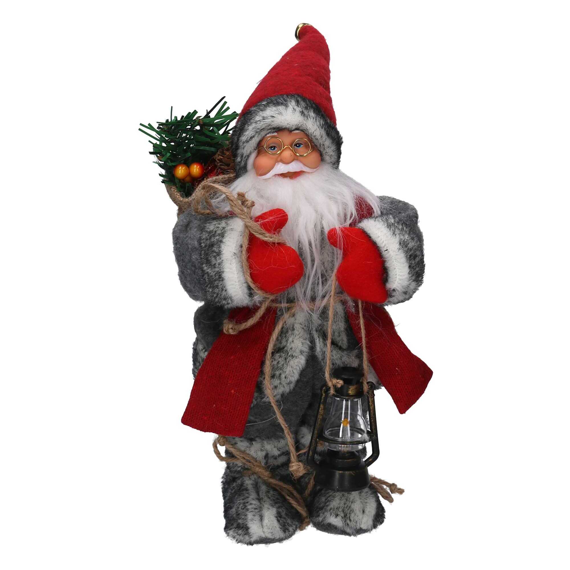 Babbo natale in tessuto con musica e movimento rosso cm15x9h30