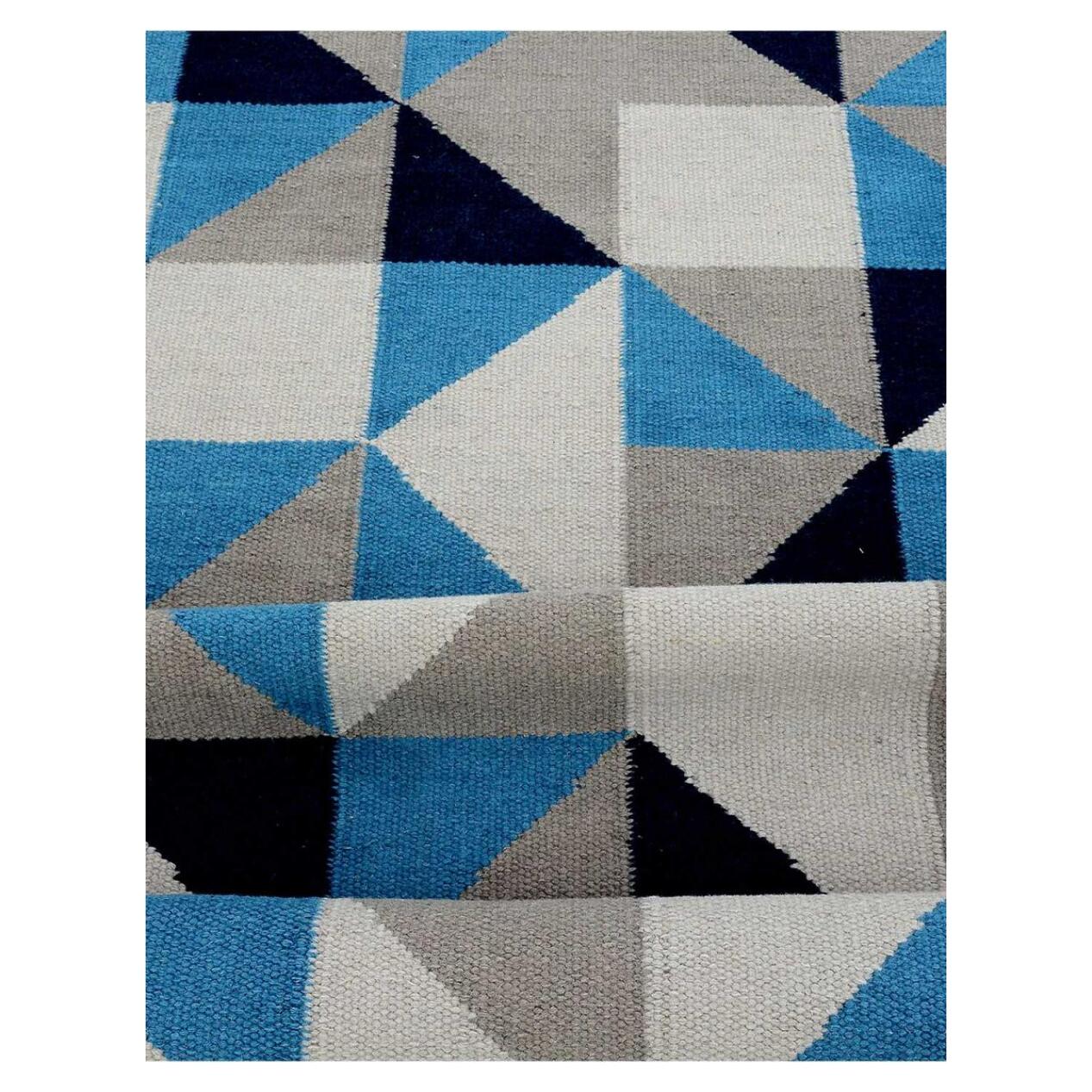 tapis salon 170x240 fait main en laine bleu et crème motif géométrique