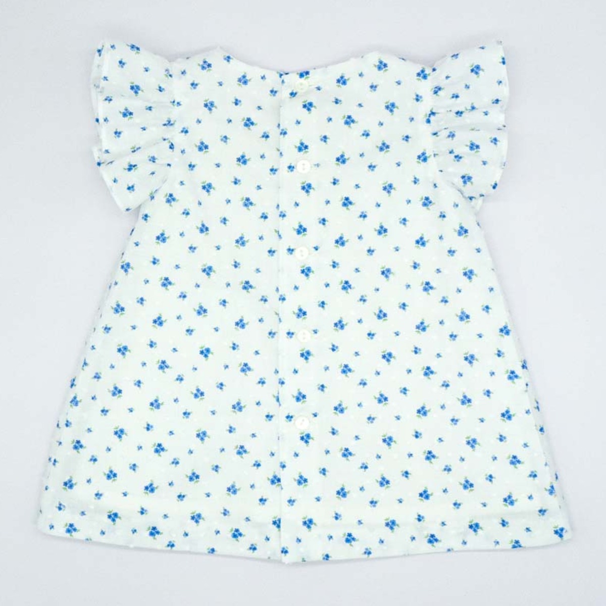 VESTIDO VOLANTE DE PLUMETI FLOR AZUL Y BLANCO