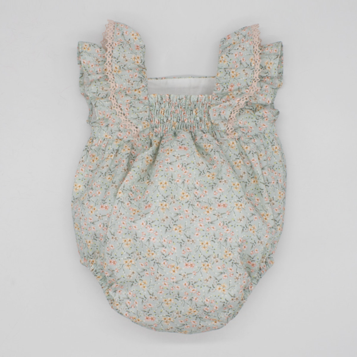 PELELE VERDE FLORECITAS Y LAZO ROSA