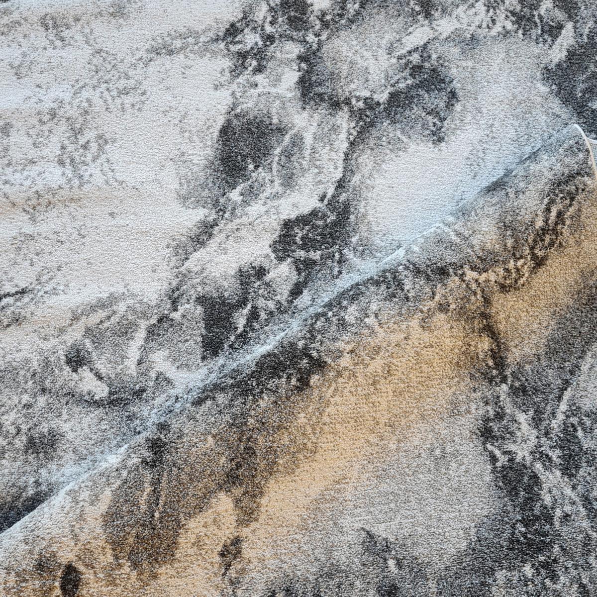 tapis moderne gris et taupe aux motifs abstraits