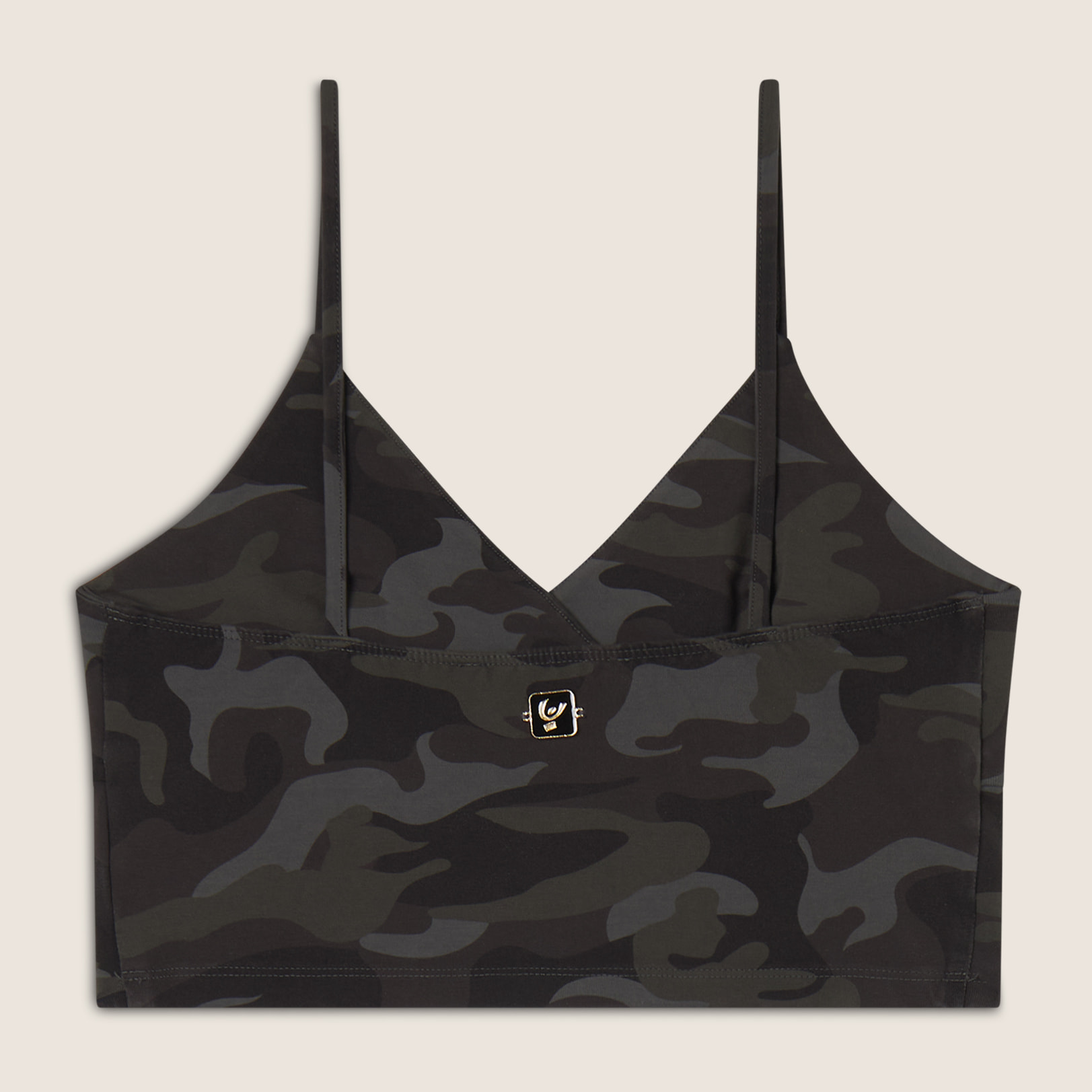 Top cropped fantasia camo con incroci frontali