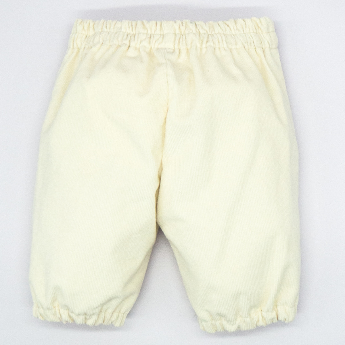 PANTALÓN GOMAS BAJO PANA BLANCO