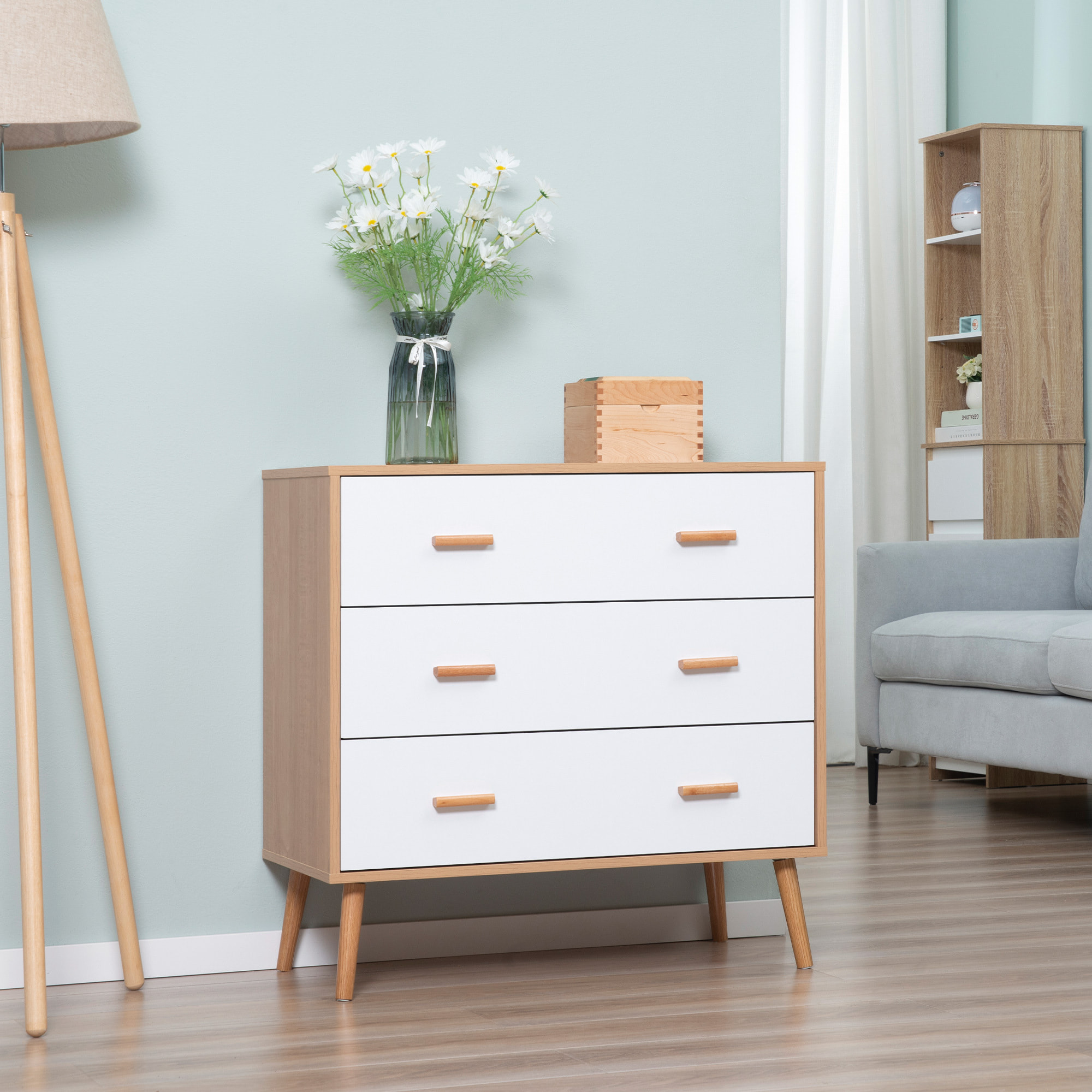 Commode design scandinave sur pieds 3 tiroirs coulissants pieds effilés inclinés panneaux particules blanc aspect bois clair