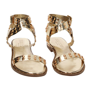Sandalias planas doradas en laminado