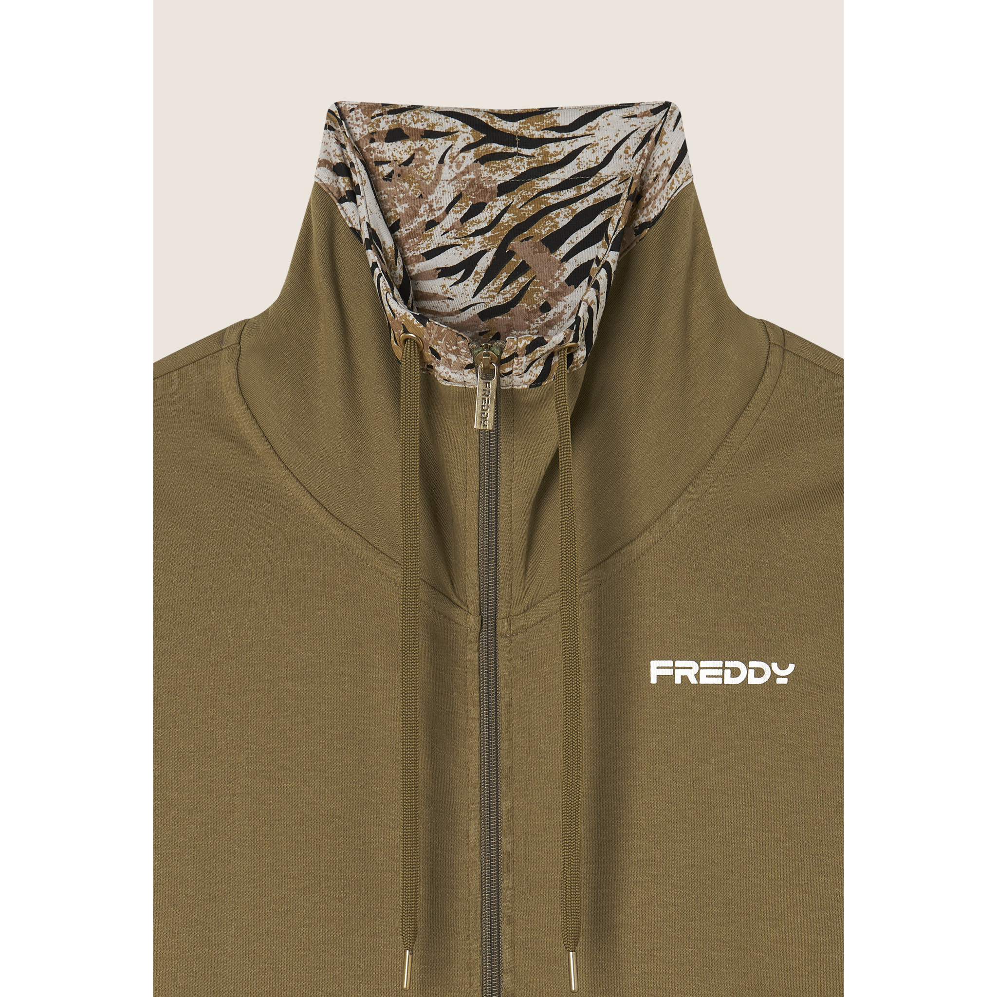 Tuta interlock con zip e collo alto interno fantasia