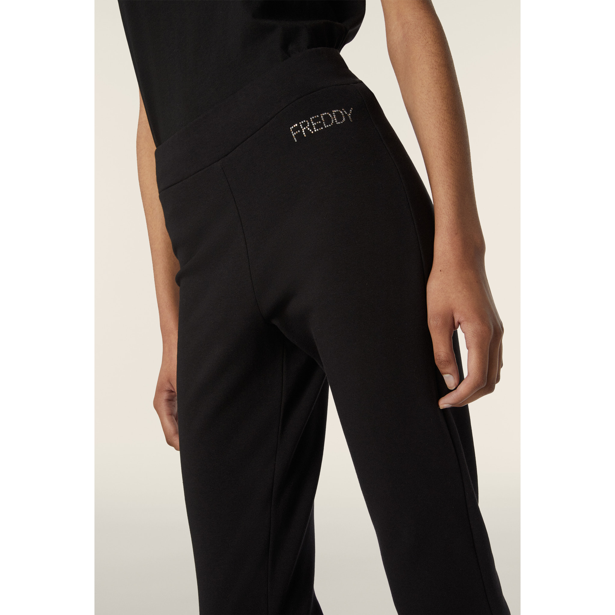 Pantalone donna in felpa garzata con fondo a zampa