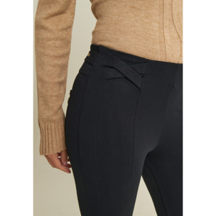 Pantaloni super skinny vita alta bande incrociate