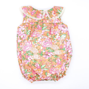 Pelele volante ocre con flor rosa