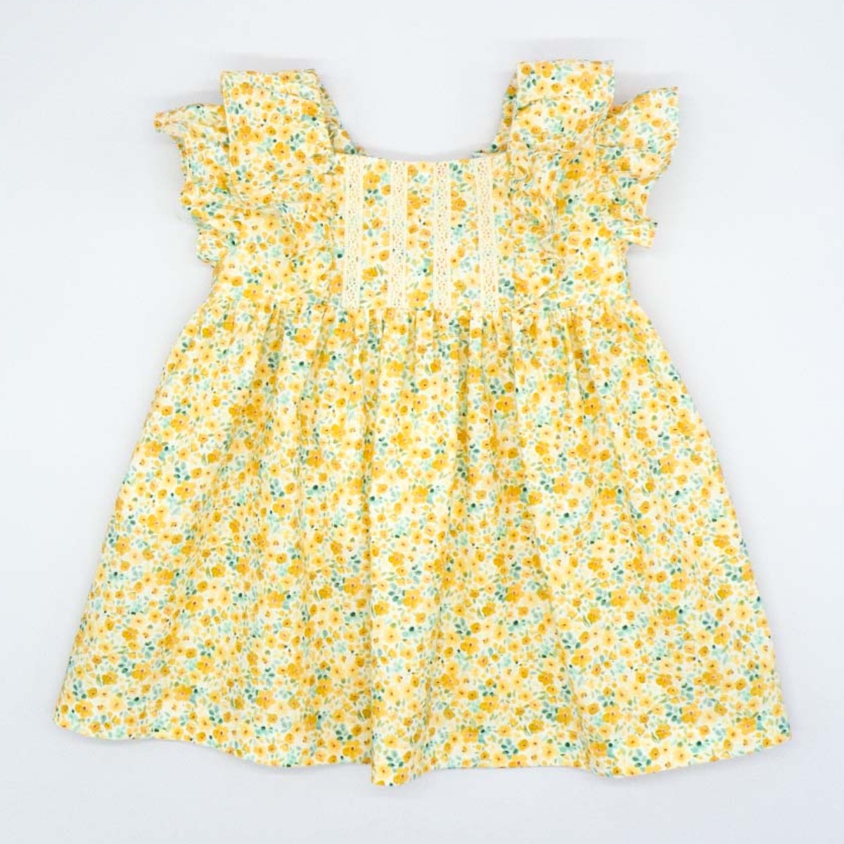 VESTIDO CON VOLANTE DE FLORES AMARILLO