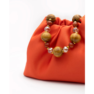 Bolso de mano con asa de piedras