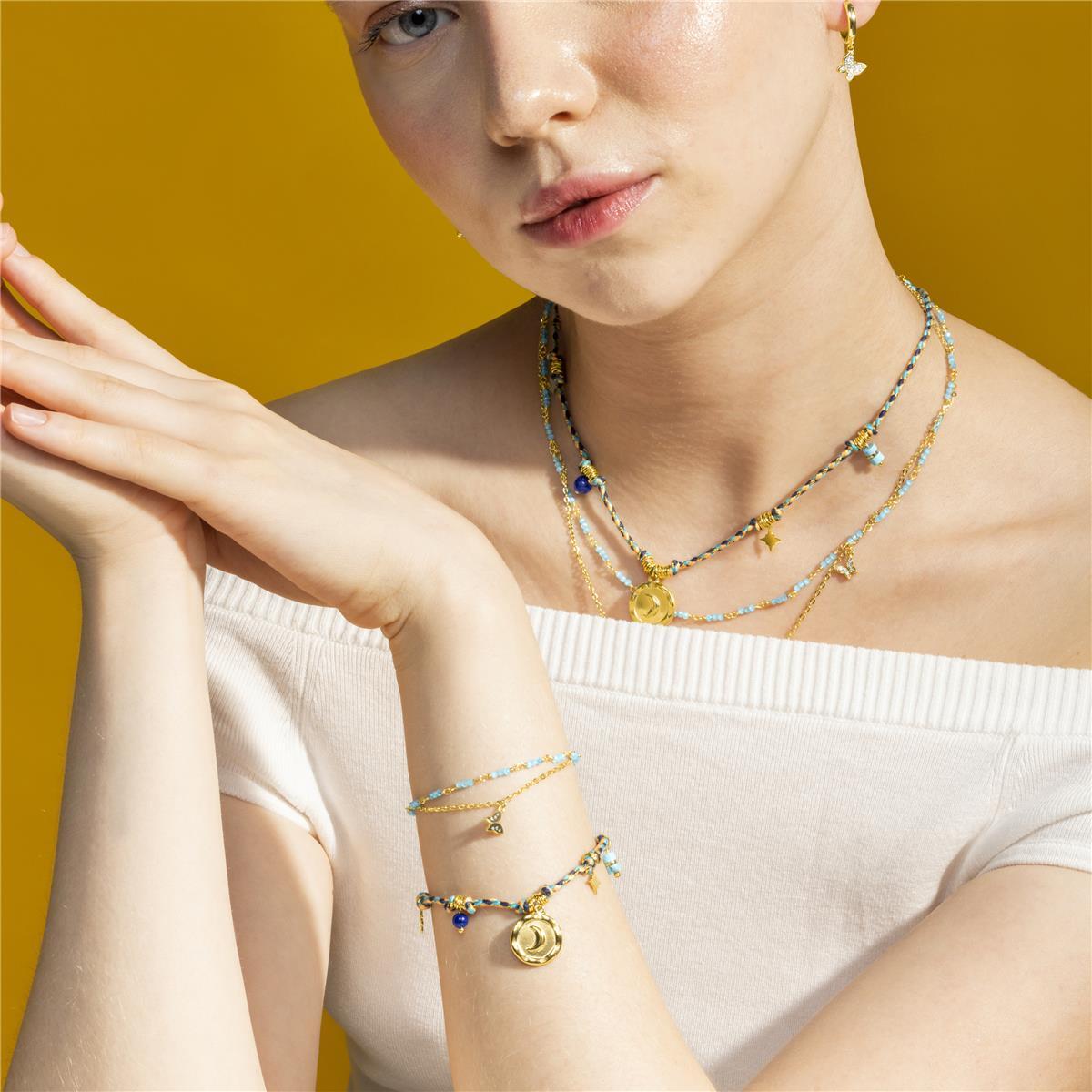 Pulsera con Cristal Azul Oscuro acabado oro 18k