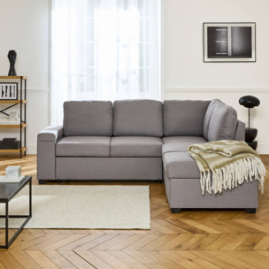 Canapé d'angle convertible. 3 places en tissu gris clair avec pouf