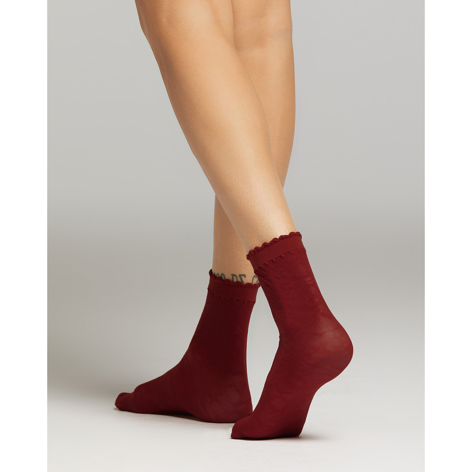 Calza Miuccia con motivo pizzo macro