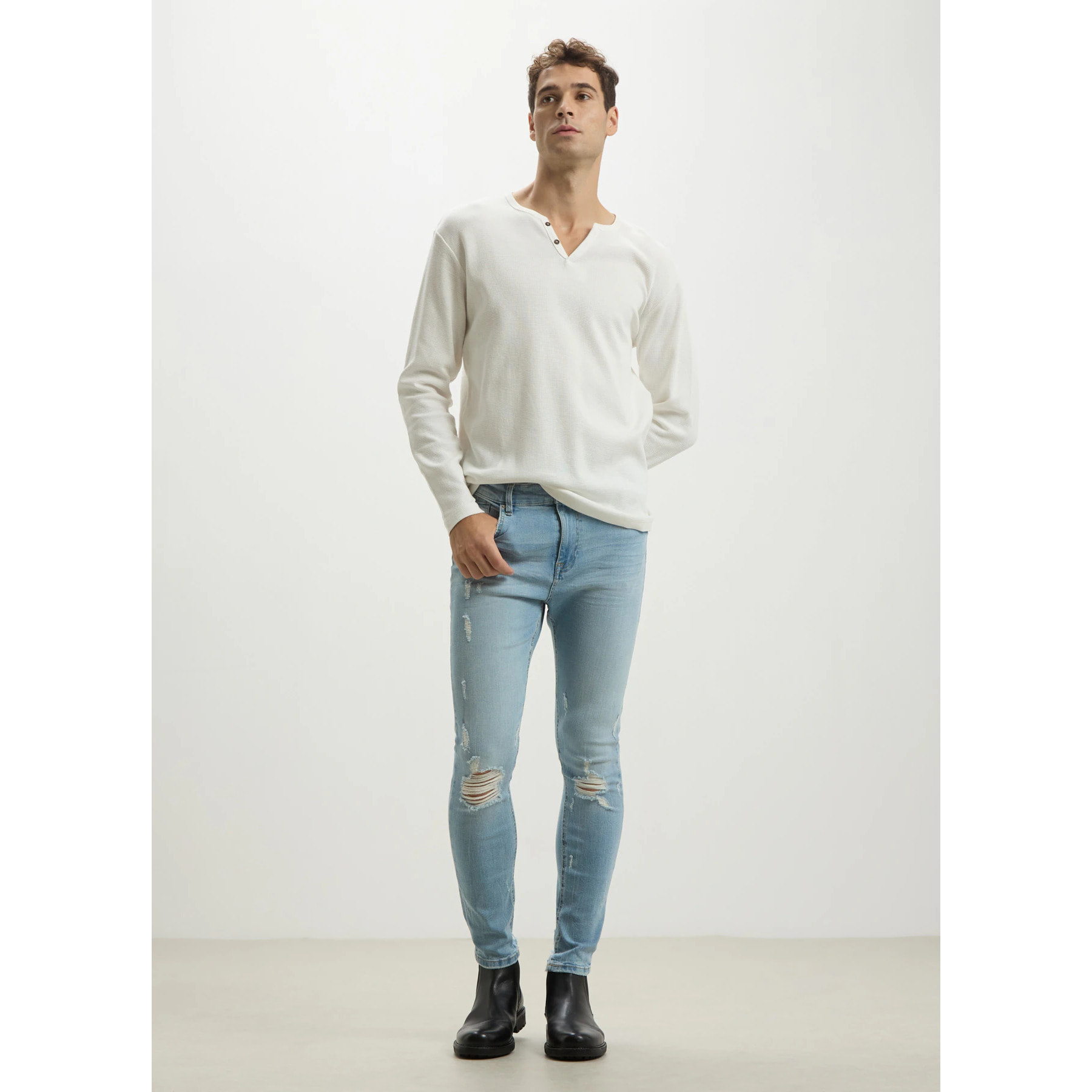 Jeans skinny con rotture