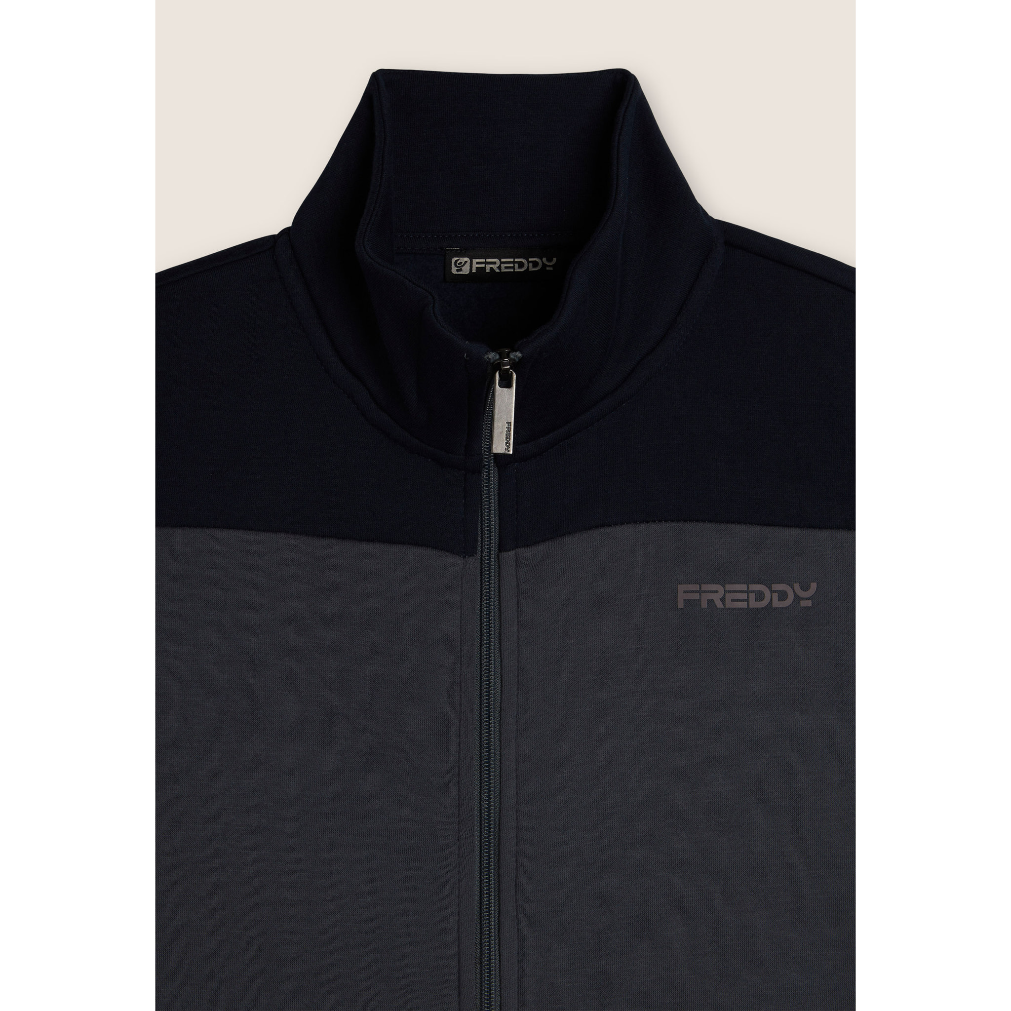 Tuta collo alto con full zip e dettagli colour block