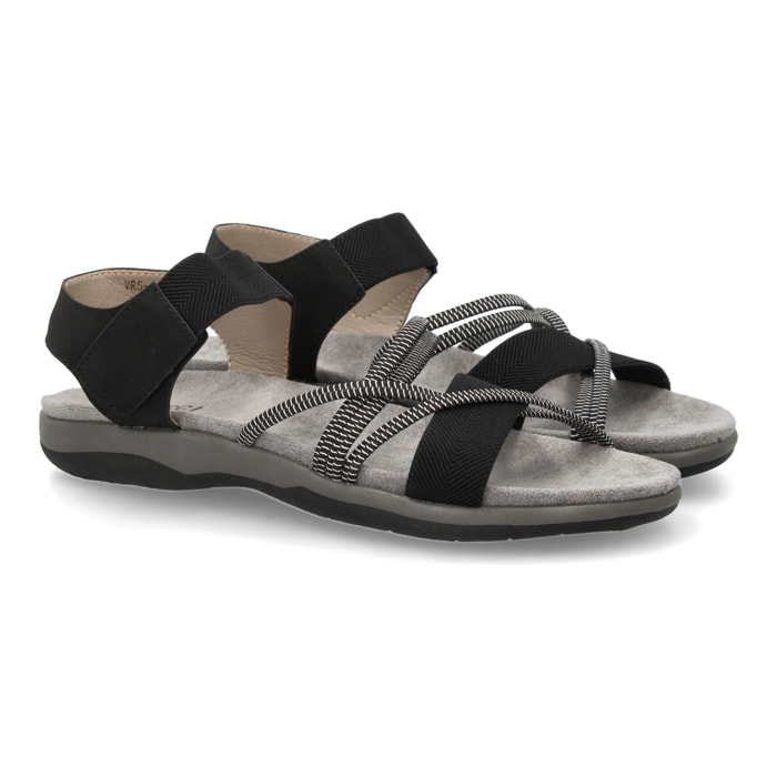 Sandalias planas de mujer diseño moderno, comodas con cierre de cierre autoadherente y con tiras elasticas cruzadas