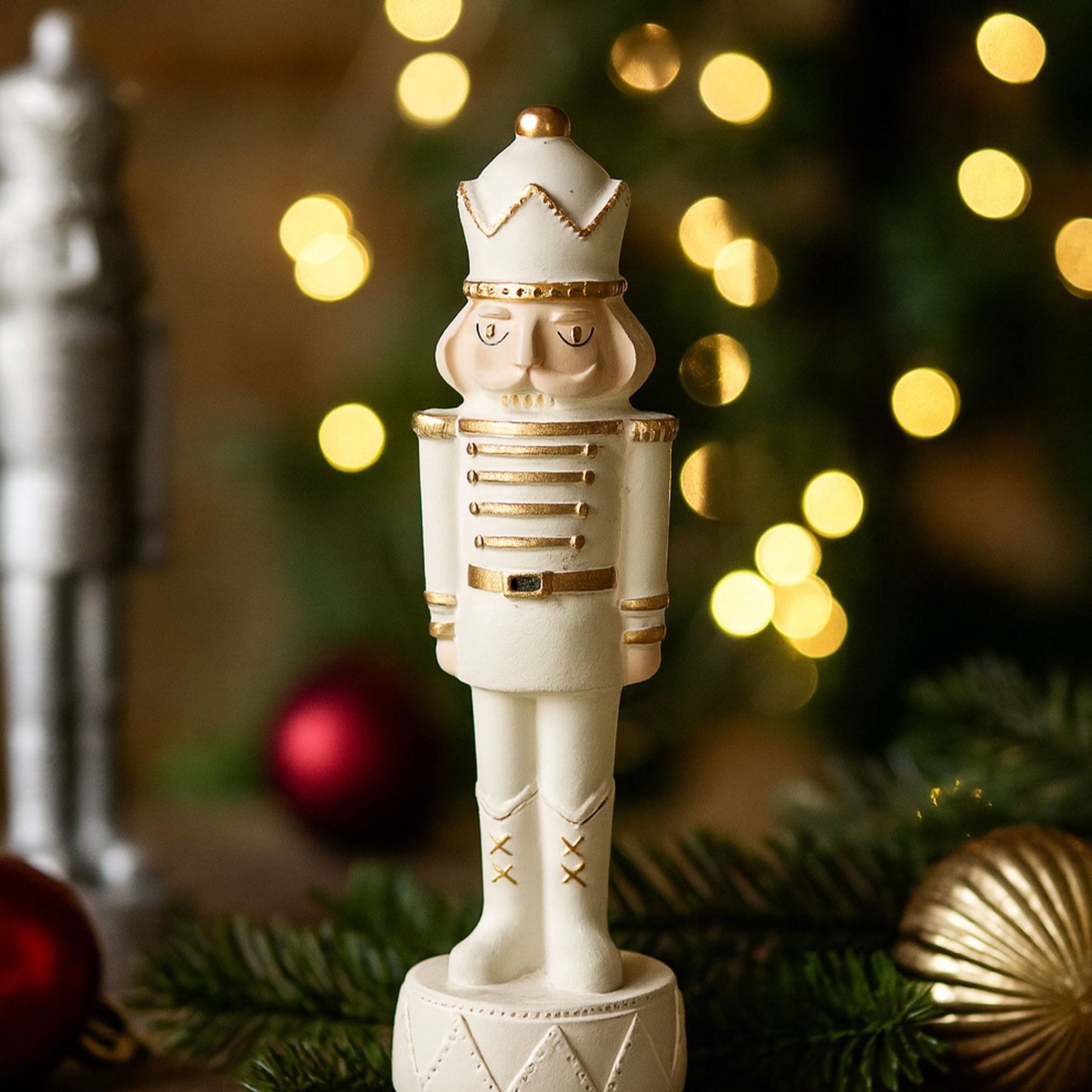 Soldado decorativo de navidad en poliresina blanco de estilo cascanueces h.25cm