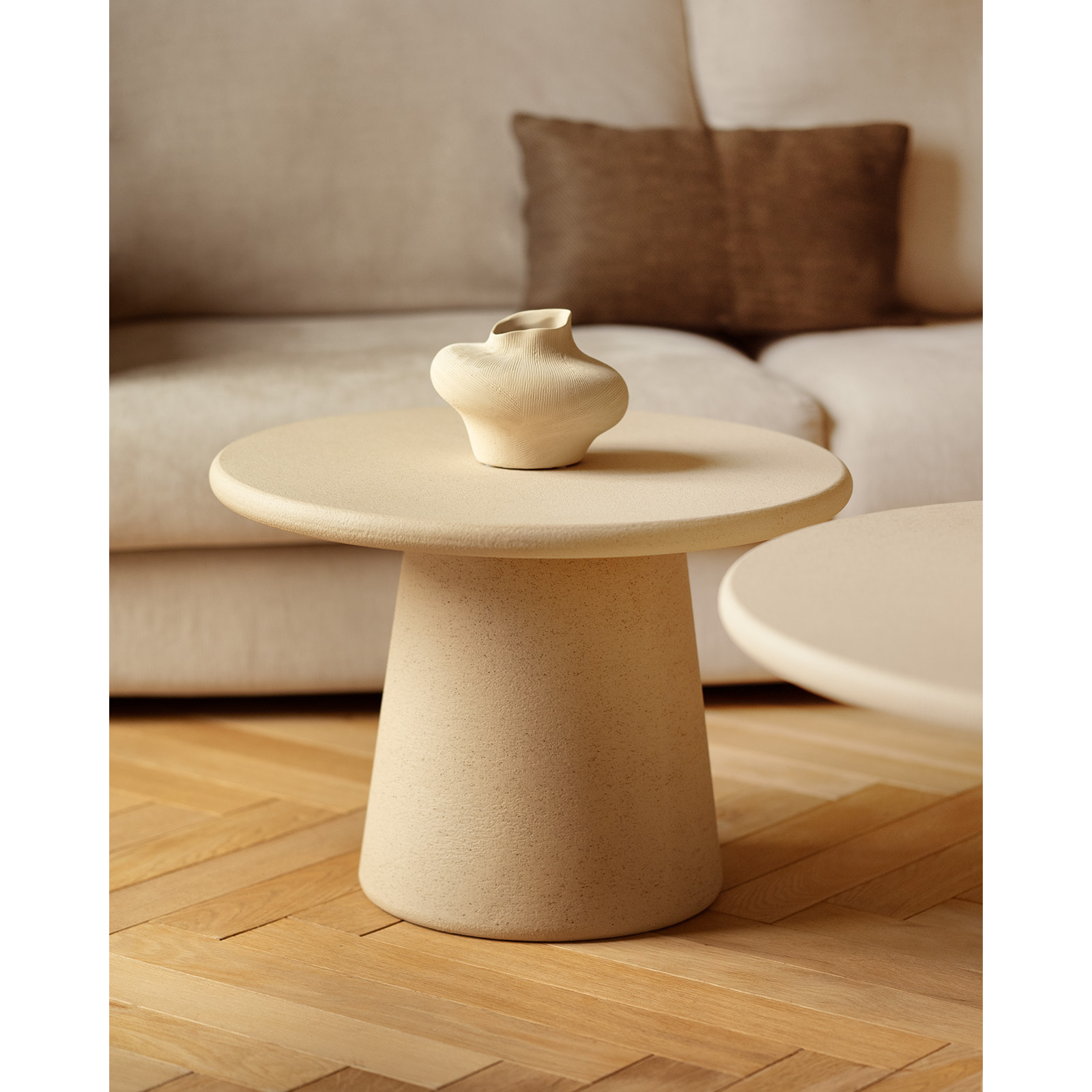 Table basse ronde en microciment ton beige en différentes tailles