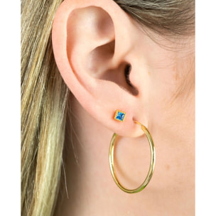 Piercing dorado con circonita azul