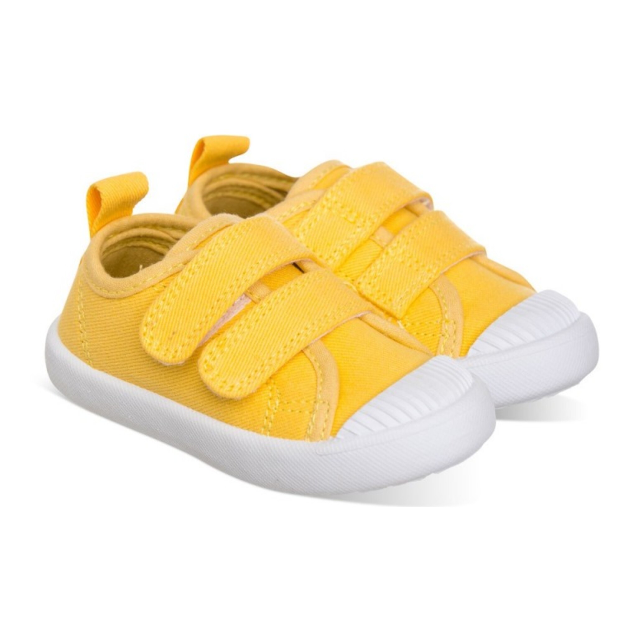 Lona color amarillo, fácil de combinar, con dos Velcros, puntera de goma y gran flexibilidad