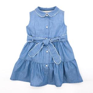 Vestido camisero azul. Falda de volantes, cuello y cinturon terminado en picunela. Botones en el centro.