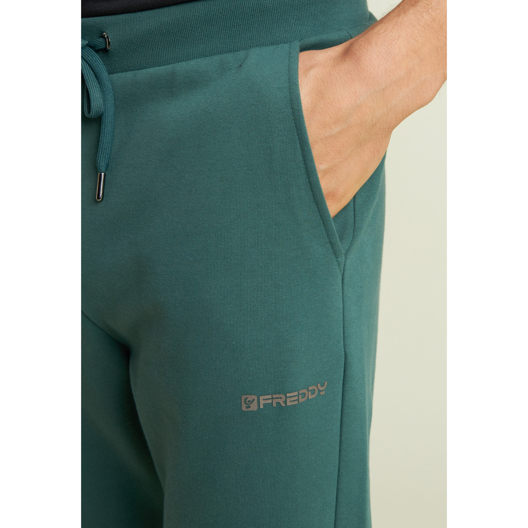 Pantaloni regular in felpa garzata con fondo in costina