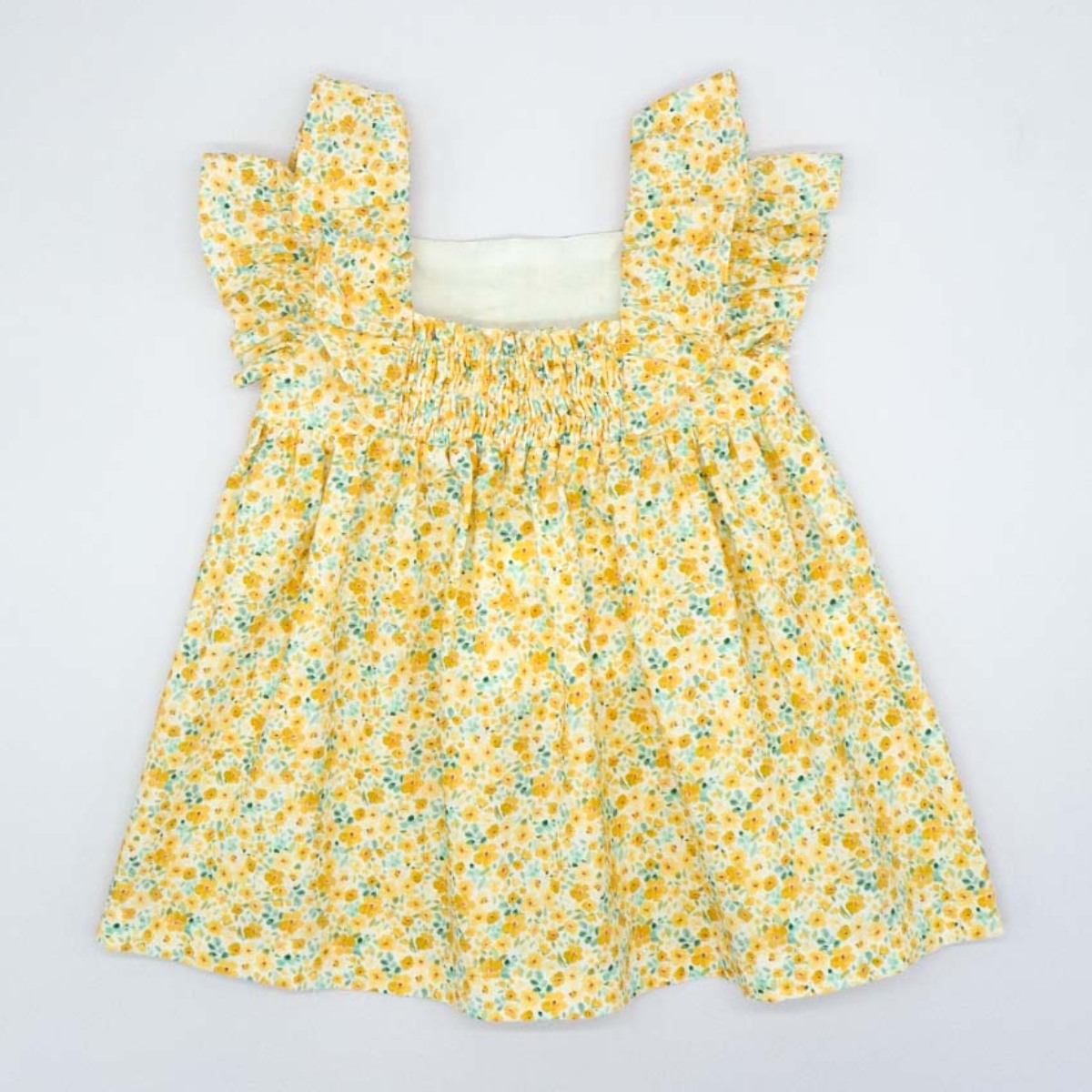 VESTIDO CON VOLANTE DE FLORES AMARILLO