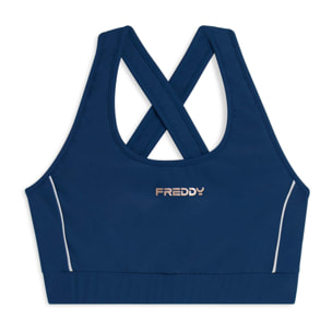 Top tecnico con spalline incrociate e profili bianchi