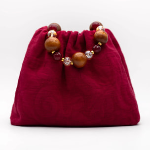 Bolso de mano con asa de piedras
