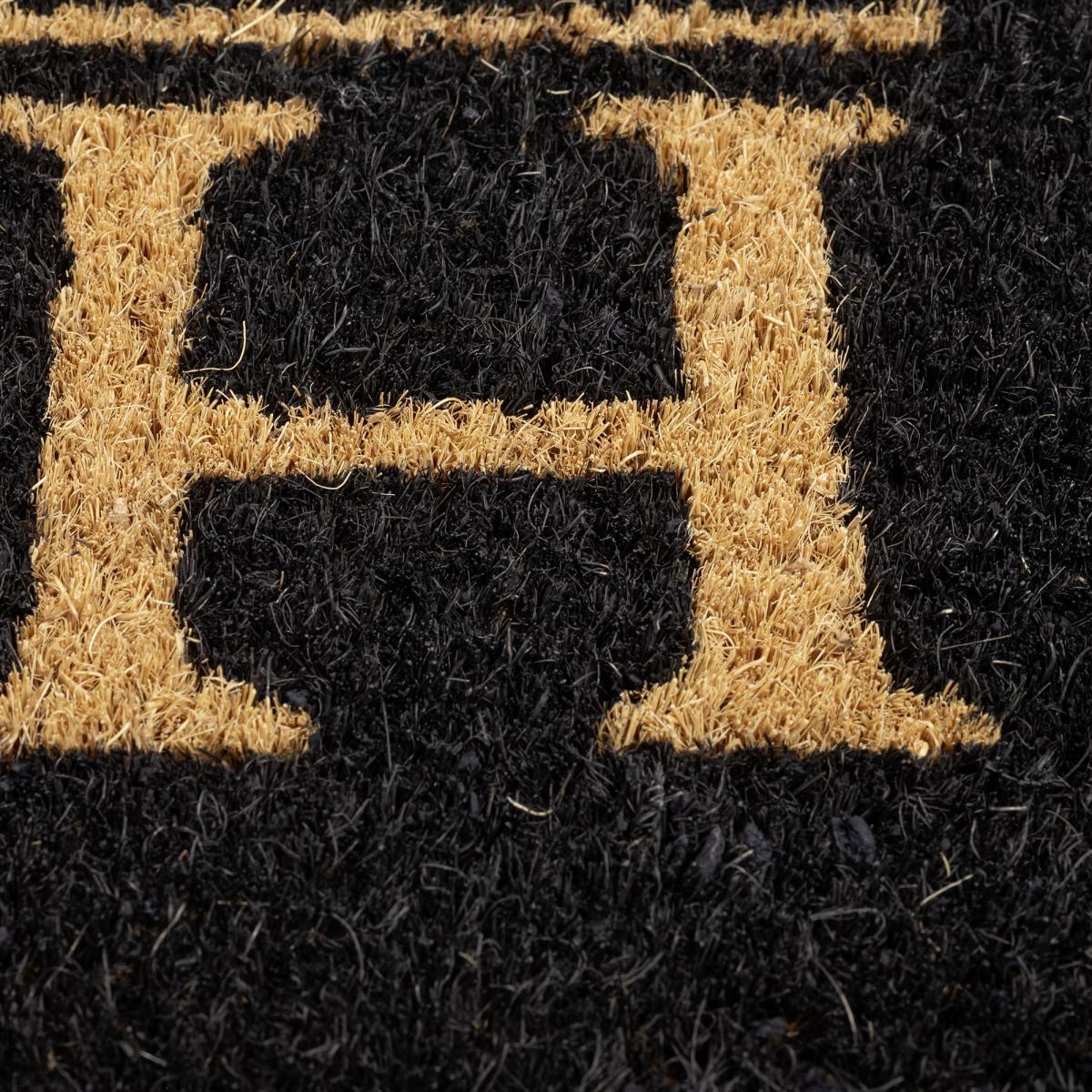 Paillasson motif texte graphique, tissé en relief, SOBRE