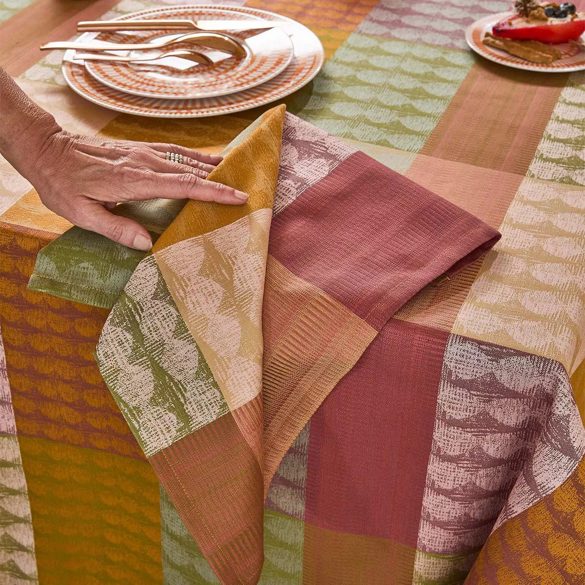 Serviette pur coton motif jacquard vert orange Mille halos prunus