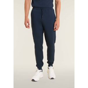 Pantaloni slim in interlock con maxi logo in rilievo