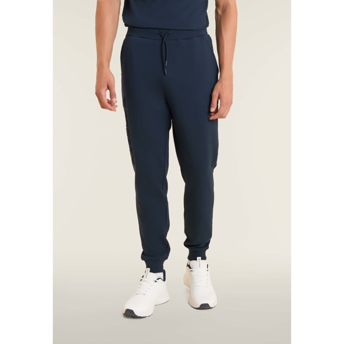 Pantaloni slim in interlock con maxi logo in rilievo