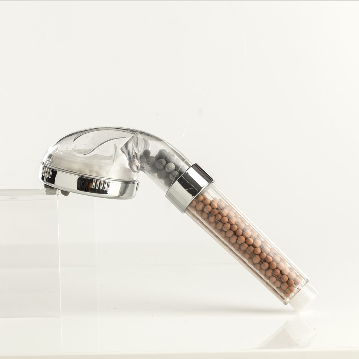 Pommeau de douche filtrant transparent