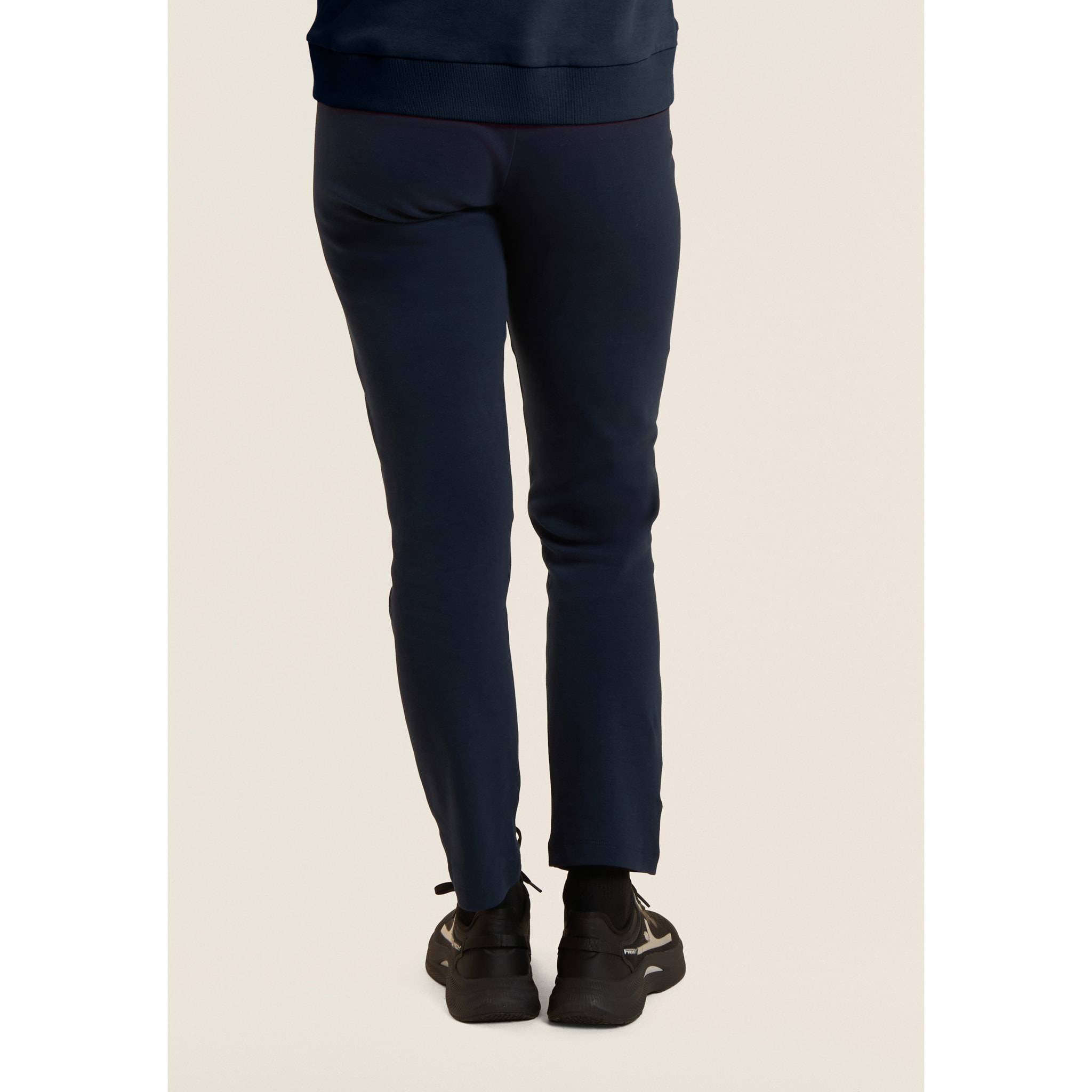 Tuta con zip e collo alto, logo in perline