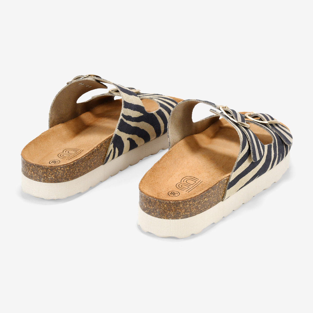 Sandalias de piel cebra con hebillas