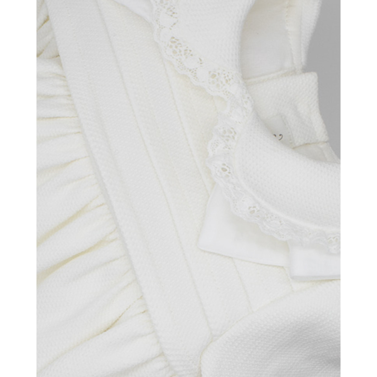 FALDÓN PIQUÉ CON LAZOS BLANCO