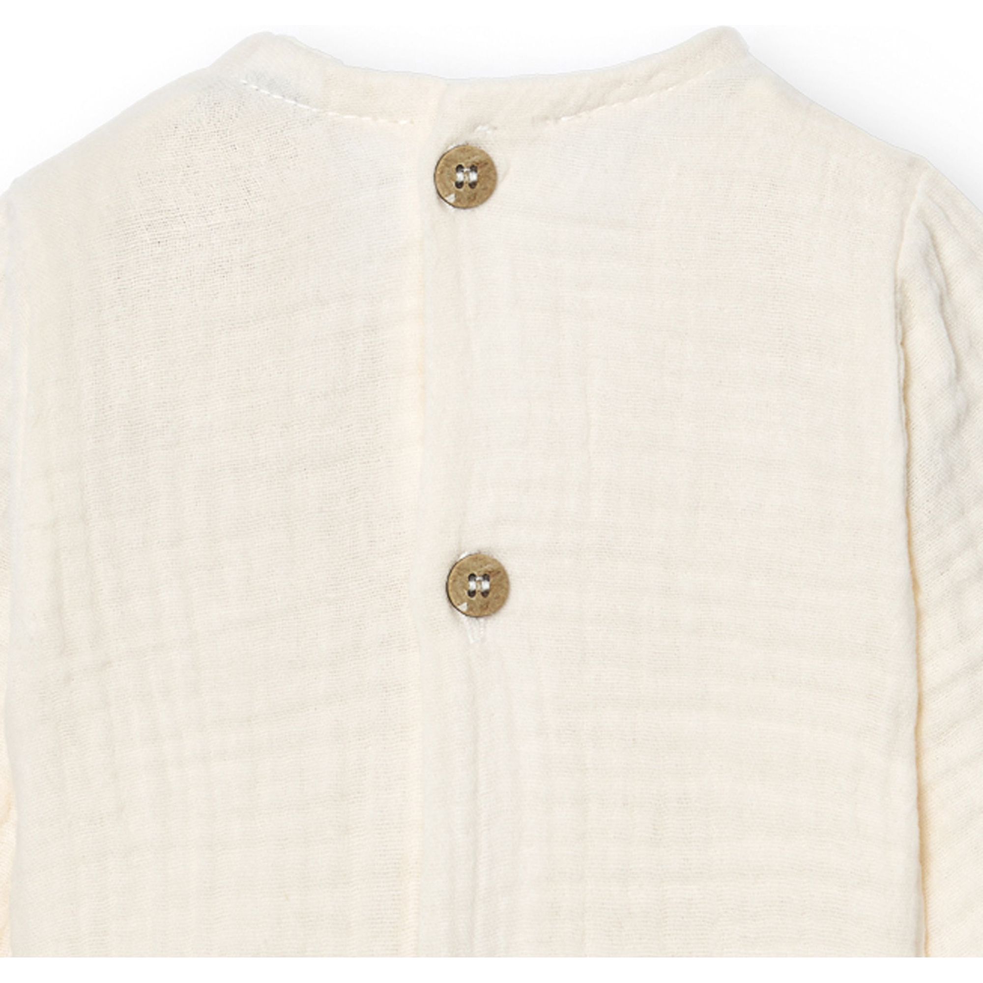 Body bebé manga larga bambula botones